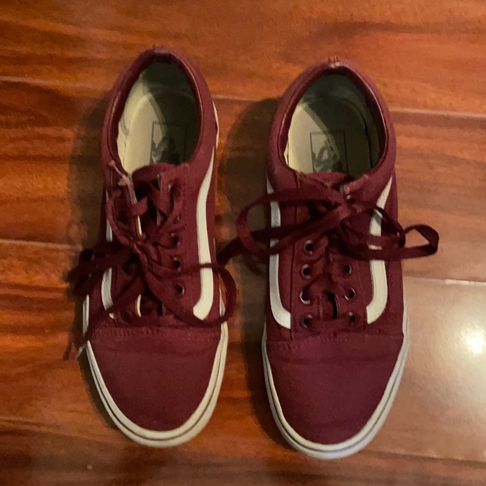 Worn maroon and white old skool vans